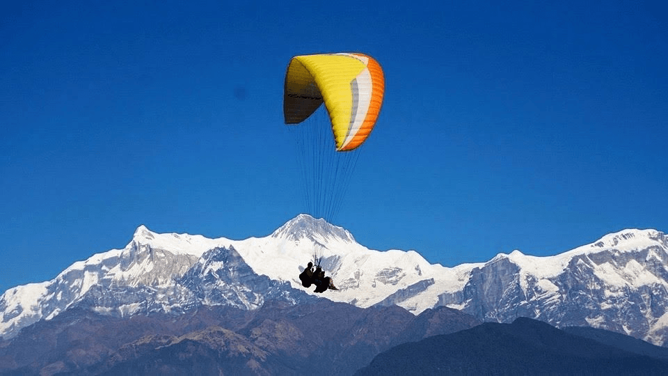 Tandem paragliding. Annapurna in the background.