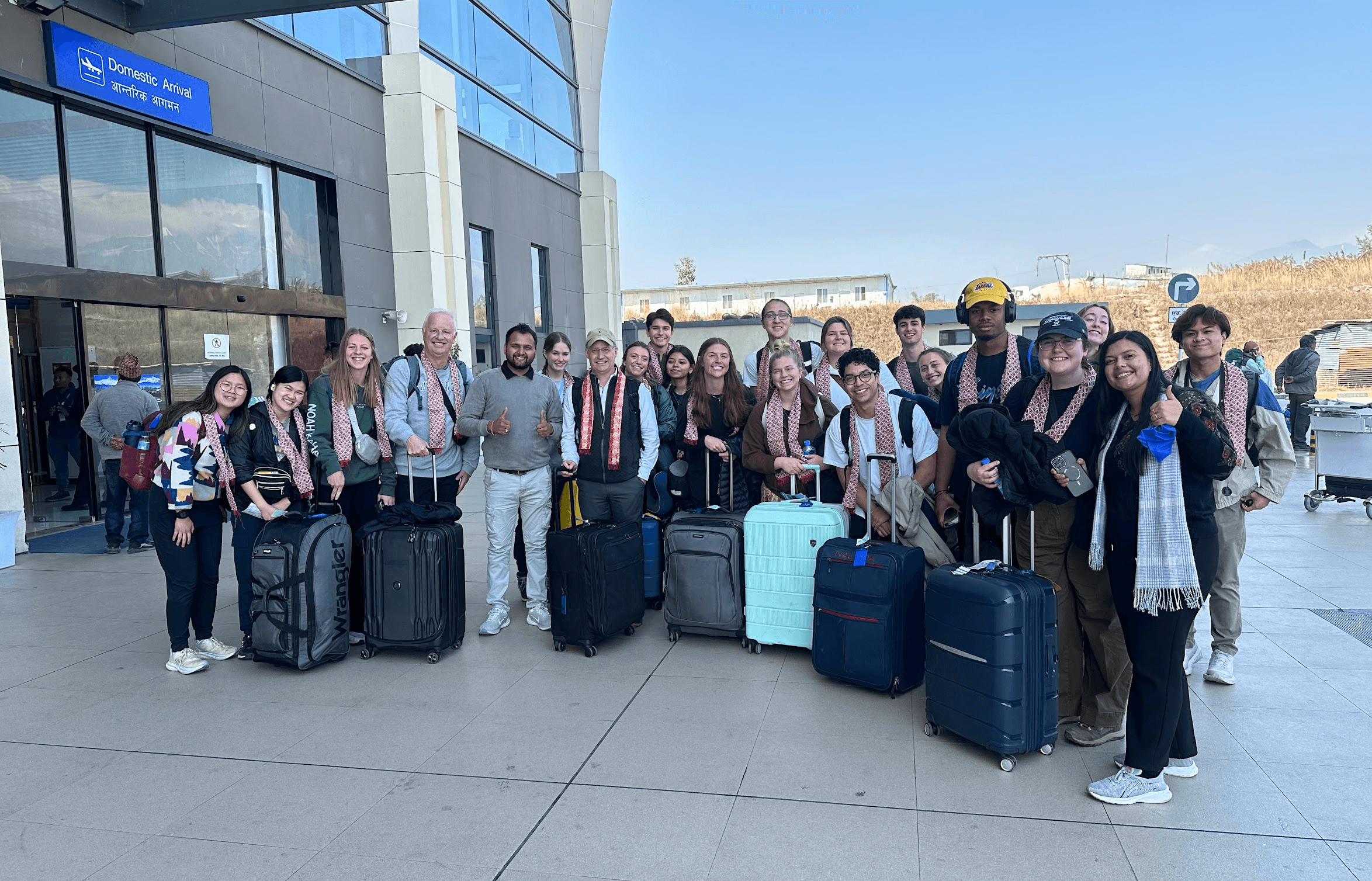 group of students welcomed at the airport