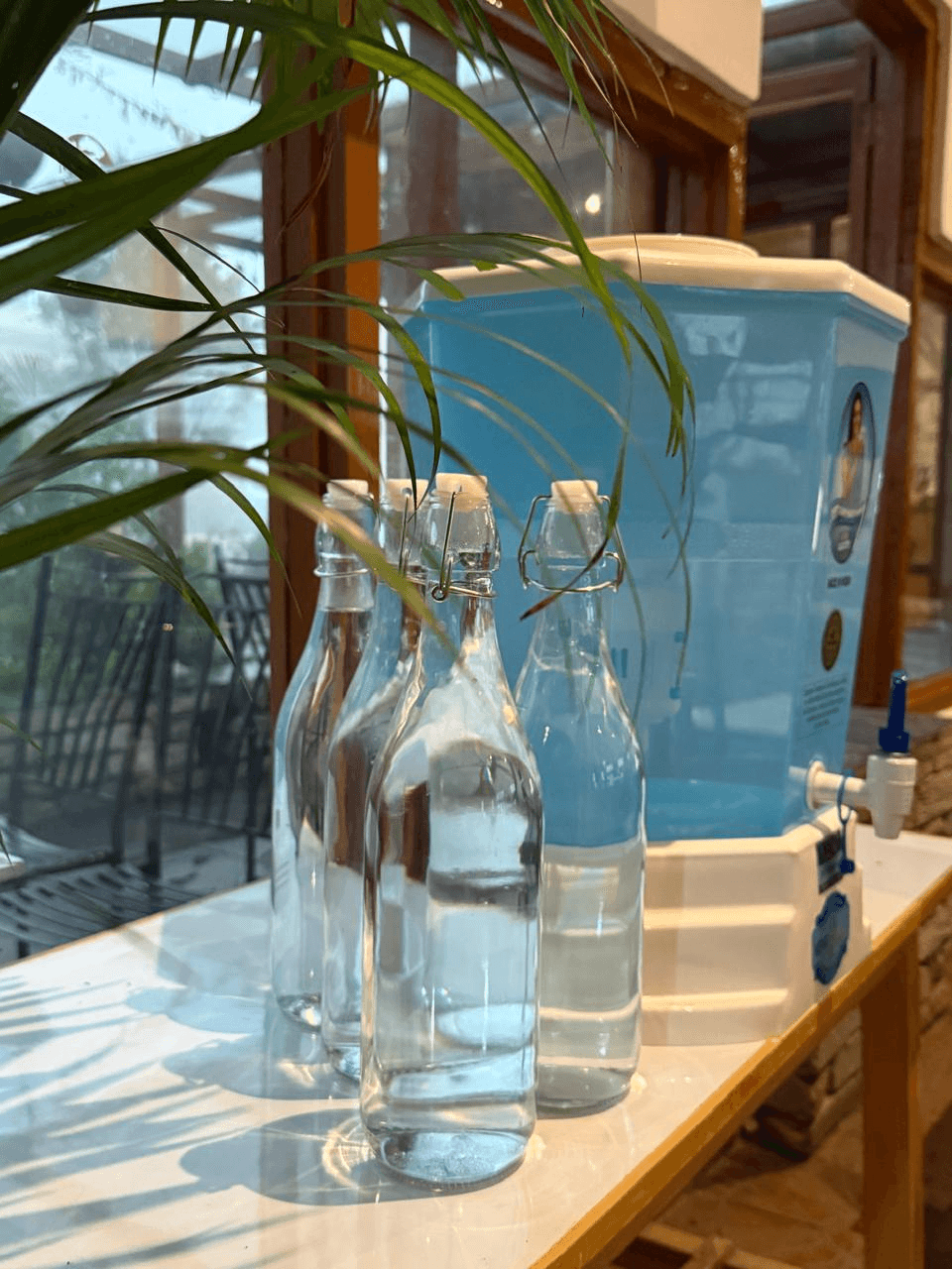 Glass bottles with a gravity based filter