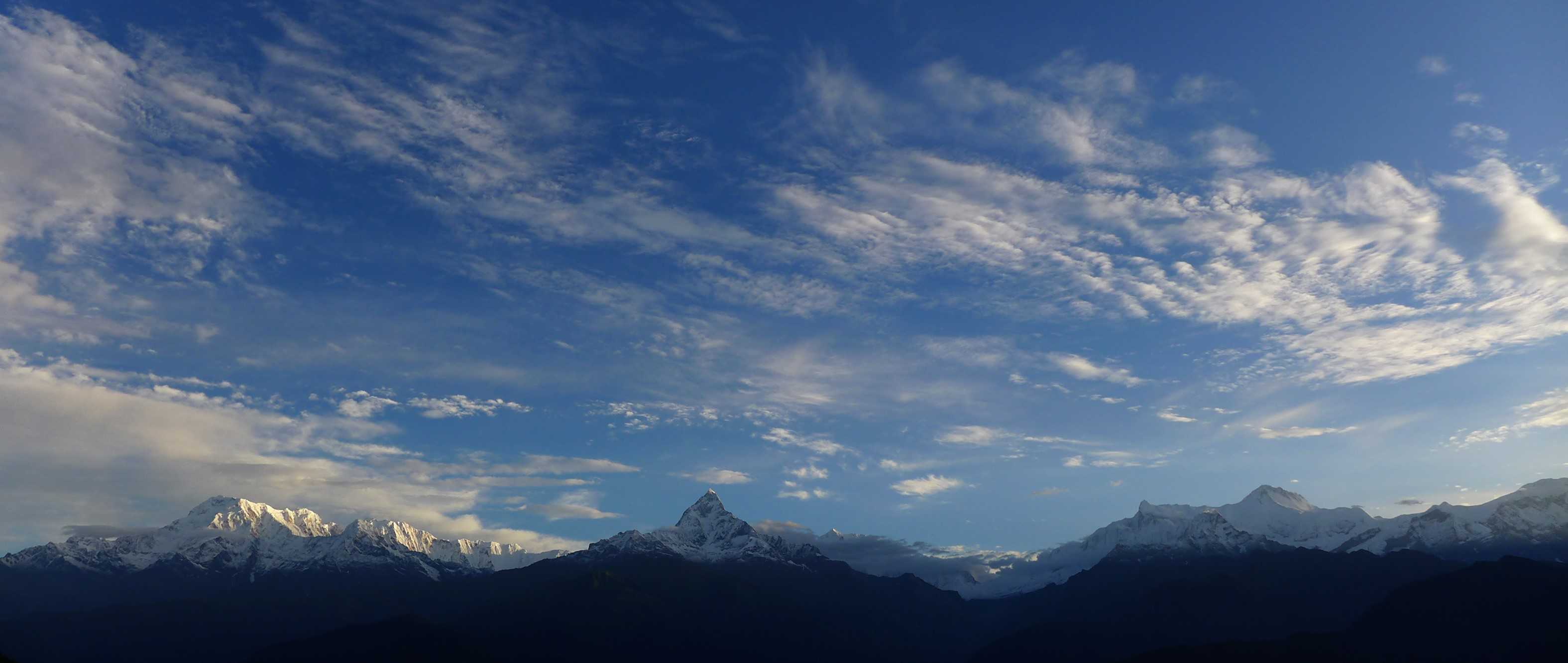 Annapurna mountain range under the cobweb cloudy sky